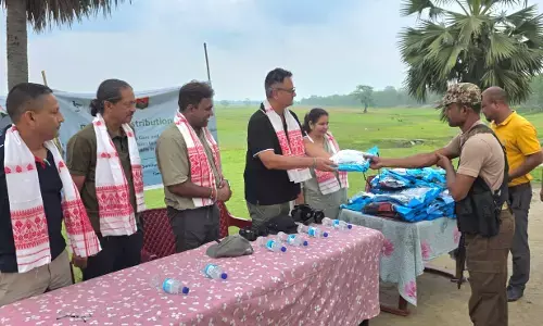 Raincoats handed out to forest personnel at Laokhowa Wildlife Sanctuary